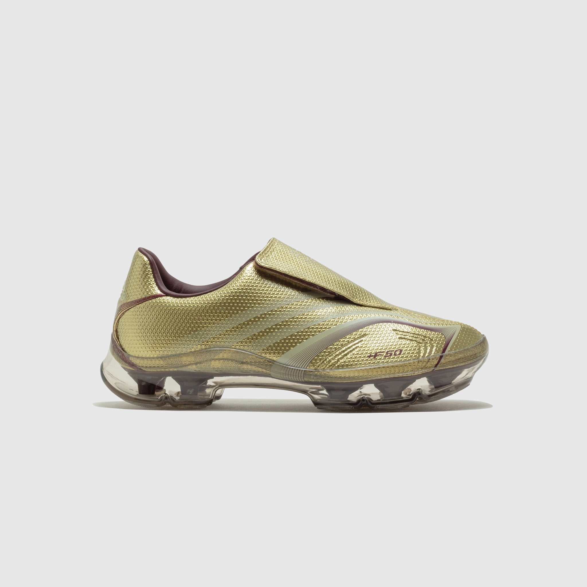 WMN'S F50 WALKABLE SHOES "GOLD METALLIC"