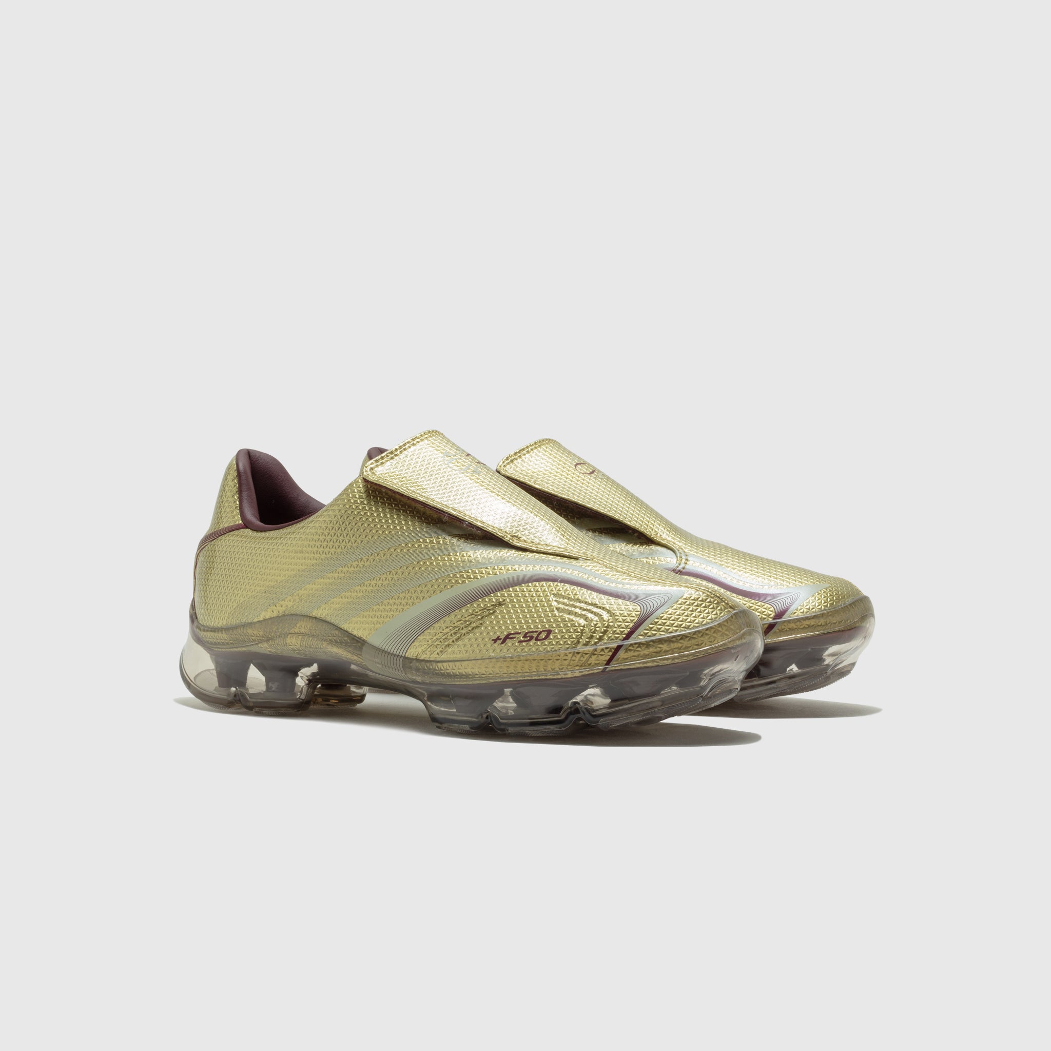 WMN'S F50 WALKABLE SHOES "GOLD METALLIC"