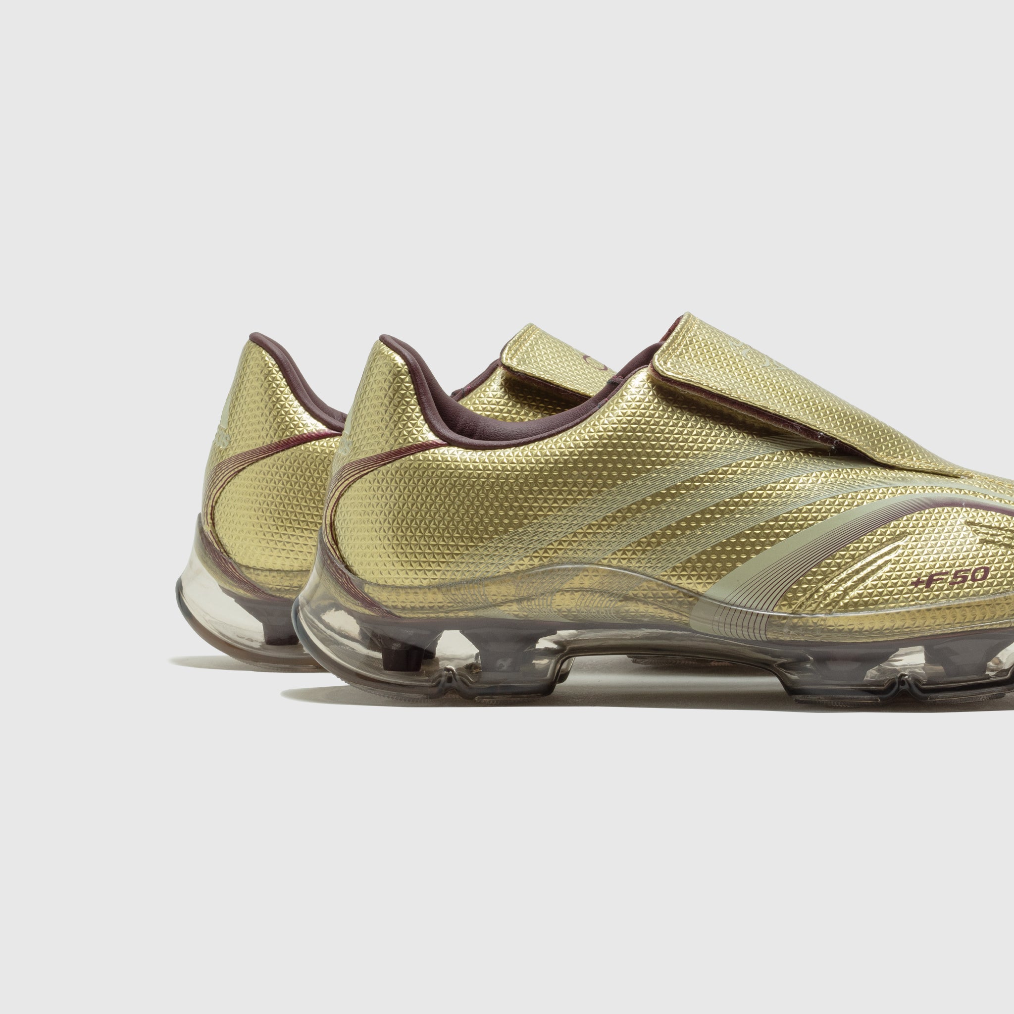 WMN'S F50 WALKABLE SHOES "GOLD METALLIC"
